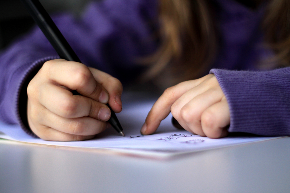 Student practicing writing