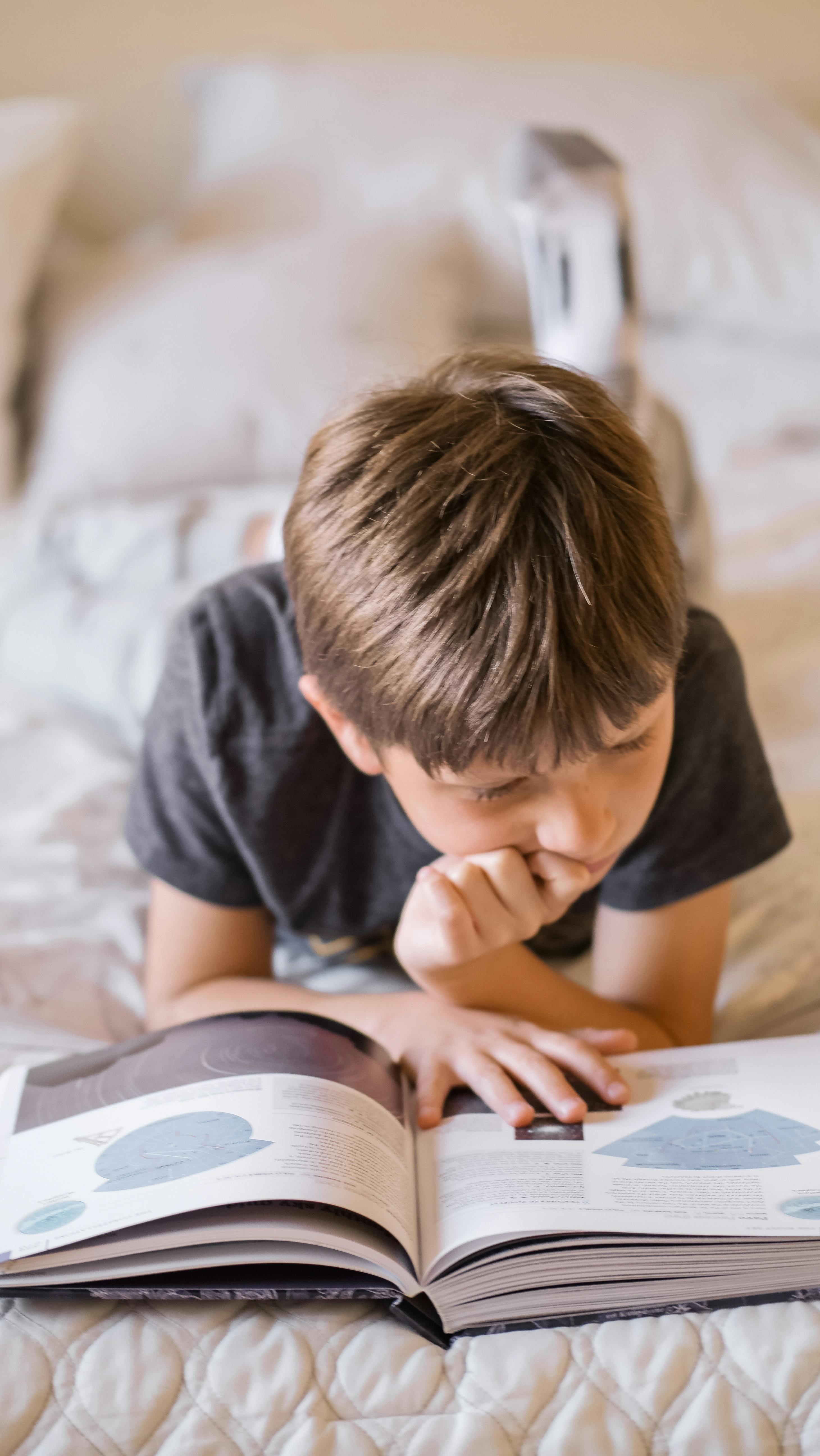 Student reading independently with focused attention